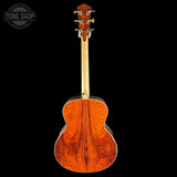Back view of a wooden acoustic guitar with 'Tone Shop' branding.