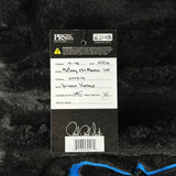 Guitar label with brand details on a textured black background
