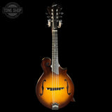 Fretted instrument with a dark brown finish on a black background, featuring 'Tone Shop' branding.