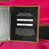 Gibson Custom Certificate of Authenticity on a pink background