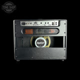 Guitar amplifier with 'Bad Cat' speaker on a black background, featuring 'Tone Shop' logo.