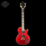 Red electric guitar on a black background with 'Tone Shop' logo.