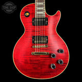 Red electric guitar with a black background