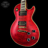 Red electric guitar with a black background