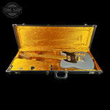 Electric guitar in a gold case with 'Tone Shop' logo.