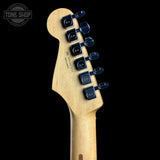 Guitar headstock with tuning pegs on a black background, featuring the Tone Shop logo.