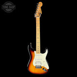 Electric guitar with a sunburst finish on a black background, featuring the Tone Shop logo.