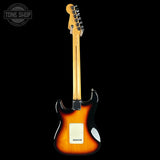 Electric guitar with sunburst finish on a black background, featuring 'Tone Shop' logo.