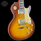 Electric guitar with a sunburst finish on a black background, featuring the Tone Shop logo.