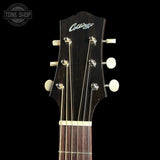 Close-up of the headstock of a dark brown acoustic guitar against a black background, featuring the 'Cruygs' brand logo in white script and white tuning pegs. A 'TONE SHOP' watermark is visible in the top-left corner.