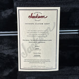 Jackson Custom Shop guitar certificate on a textured black surface