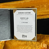 Gibson Custom Certificate of Authenticity for Murphy Lab Heavy Aging on a wooden surface