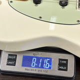 Digital kitchen scale displaying weight on a wooden surface