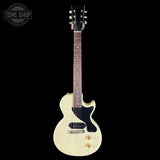 White electric guitar with a black pickguard on a white background, featuring the Tone Shop logo.