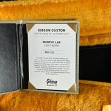 Gibson Custom certificate of authenticity on a textured surface