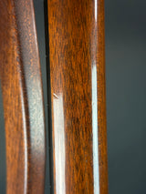 Close-up of a wooden object with a dark gray background