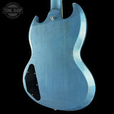 Blue electric guitar body with 'Tone Shop' logo in the corner