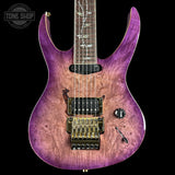 Purple electric guitar with a visible brand logo on a black background