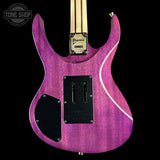 Purple electric guitar with a black pickguard on a black background