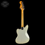 A Fender Telecaster electric guitar shown from the back, featuring a silver glitter finish body and a natural maple neck, photographed against a solid black background.
