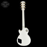 White electric guitar on a black background with 'Tone Shop' logo.