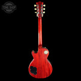 Red electric guitar on a black background with 'Tone Shop' logo.