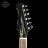 Guitar headstock with Epiphone logo on a black background