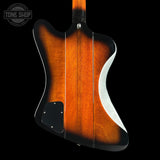 Guitar body with a sunburst finish on a black background, featuring the Tone Shop logo.