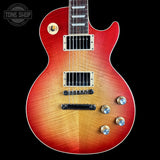 Electric guitar with a sunburst finish on a black background, featuring the Tone Shop logo.