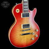 Electric guitar with a sunburst finish on a black background, featuring the Tone Shop logo.