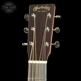Guitar headstock with Martin & Co logo on a black background