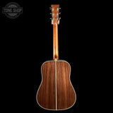 Wooden acoustic guitar on a black background with 'Tone Shop' logo.