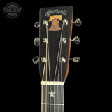 Gibson guitar headstock with brand logo on a black background