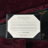 Certificate of Authenticity for a Martin guitar on a dark background