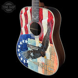 Acoustic guitar with American flag and eagle design on a black background