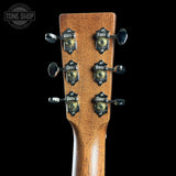 Guitar headstock with tuning pegs on a black background, featuring 'Tone Shop' logo.