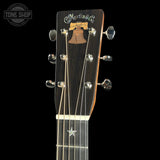 Guitar headstock with Martin & Co. logo on a black background