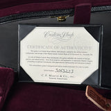 Certificate of Authenticity for a Martin guitar inside a guitar case.