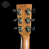 Guitar headstock with tuning pegs on a black background, featuring 'Tone Shop' logo.
