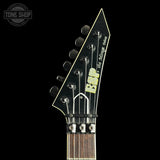 Close-up of a guitar headstock against a black background, featuring a black faceted headstock with six tuning pegs, a yellow and black 'DSP' logo, and white script text reading 'The Mirror Image'. The neck has a dark wood finish with gold-toned fretboard edges and hardware.