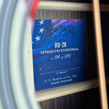 C.F. Martin & Co. label on a guitar with 'HD-28 SemiQuincenennial' text.