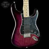 Electric guitar with a maroon and black finish on a black background, featuring the Tone Shop logo.
