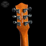 Close-up of the headstock of a Yamaha DXZ7110B01 electric guitar, showing the six tuning pegs and wood grain against a black background.