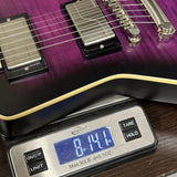 Used Epiphone Extura Prophecy Purple Tiger on scale displaying weight.