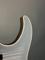 Scratch on horn of Used Schecter Sunset 24-7 USA Custom Shop Trans Black Pearl.