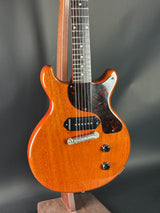 Wooden electric guitar on a dark background