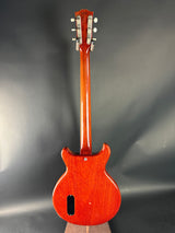 Wooden guitar body with a dark gray background