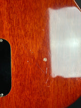 Close-up of a wooden surface with a white patch and visible grain.