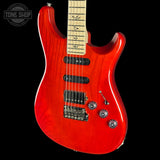 Red electric guitar with a black background