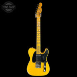 A yellow Fender Telecaster electric guitar with a black pickguard and chrome hardware, shown against a solid black background with a Tone Shop logo in the top-left corner.